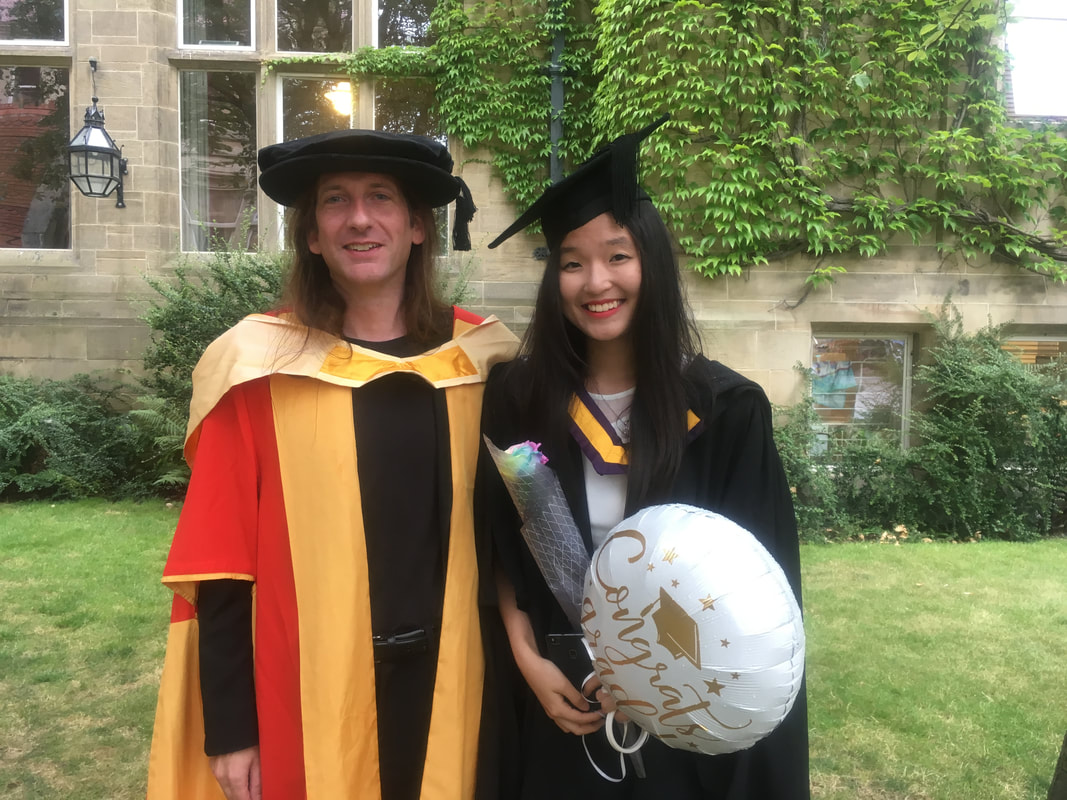 Hailey celebrating graduation with members of the lab