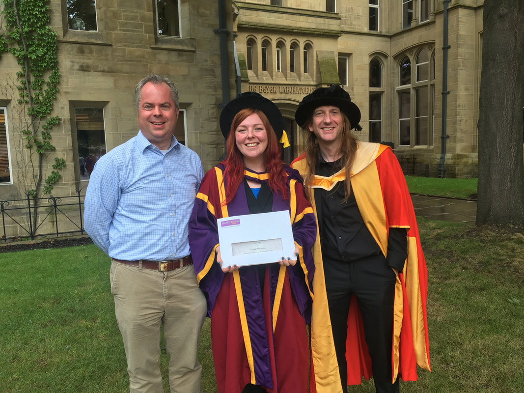 Emily Williams celebrating graduation with Luke Jones and Andrew Stewart